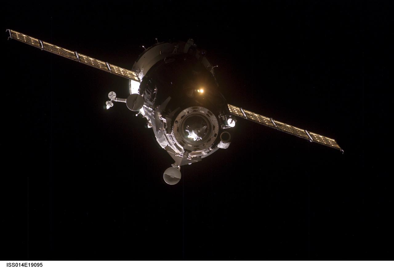 ISS014-E-19095 (9 April 2007) --- Backdropped by the blackness of space, the Soyuz 14 (TMA-10) spacecraft approaches the International Space Station. Onboard the spacecraft are cosmonauts Fyodor N. Yurchikhin, Expedition 15 commander; and Oleg V. Kotov, Soyuz commander and flight engineer, both representing Russia's Federal Space Agency; along with spaceflight participant Charles Simonyi. With Kotov at the controls, the Soyuz linked up to the Zarya module nadir port at 2:10 p.m. (CDT) on April 9, 2007. The docking followed Saturday's launch from Baikonur Cosmodrome in Kazakhstan.