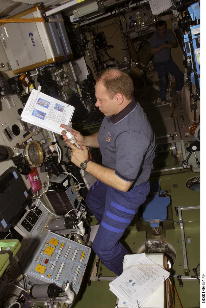 ISS014-E-19179 (April 2007) --- Cosmonaut Oleg V. Kotov, Expedition 15 flight engineer representing Russia's Federal Space Agency, works with a test sample in the Zvezda Service Module of the International Space Station.