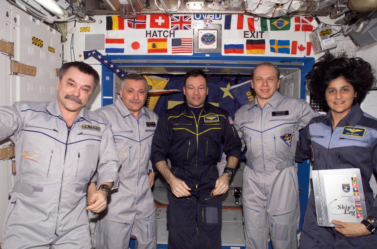 ISS014-E-19526 (17 April 2007) --- The crewmembers onboard the International Space Station pose for a group portrait during the ceremony of Changing-of-Command from Expedition 14 to Expedition 15 in the Destiny laboratory. From the left are cosmonauts Mikhail Tyurin, Expedition 14 flight engineer; Fyodor N. Yurchikhin, Expedition 15 commander; astronaut Michael E. Lopez-Alegria, Expedition 14 commander and NASA space station science officer; cosmonaut Oleg V. Kotov, Expedition 15 flight engineer; and astronaut Sunita L. Williams, Expedition 14/15 flight engineer. Tyurin, Yurchikhin and Kotov represent Russia's Federal Space Agency.