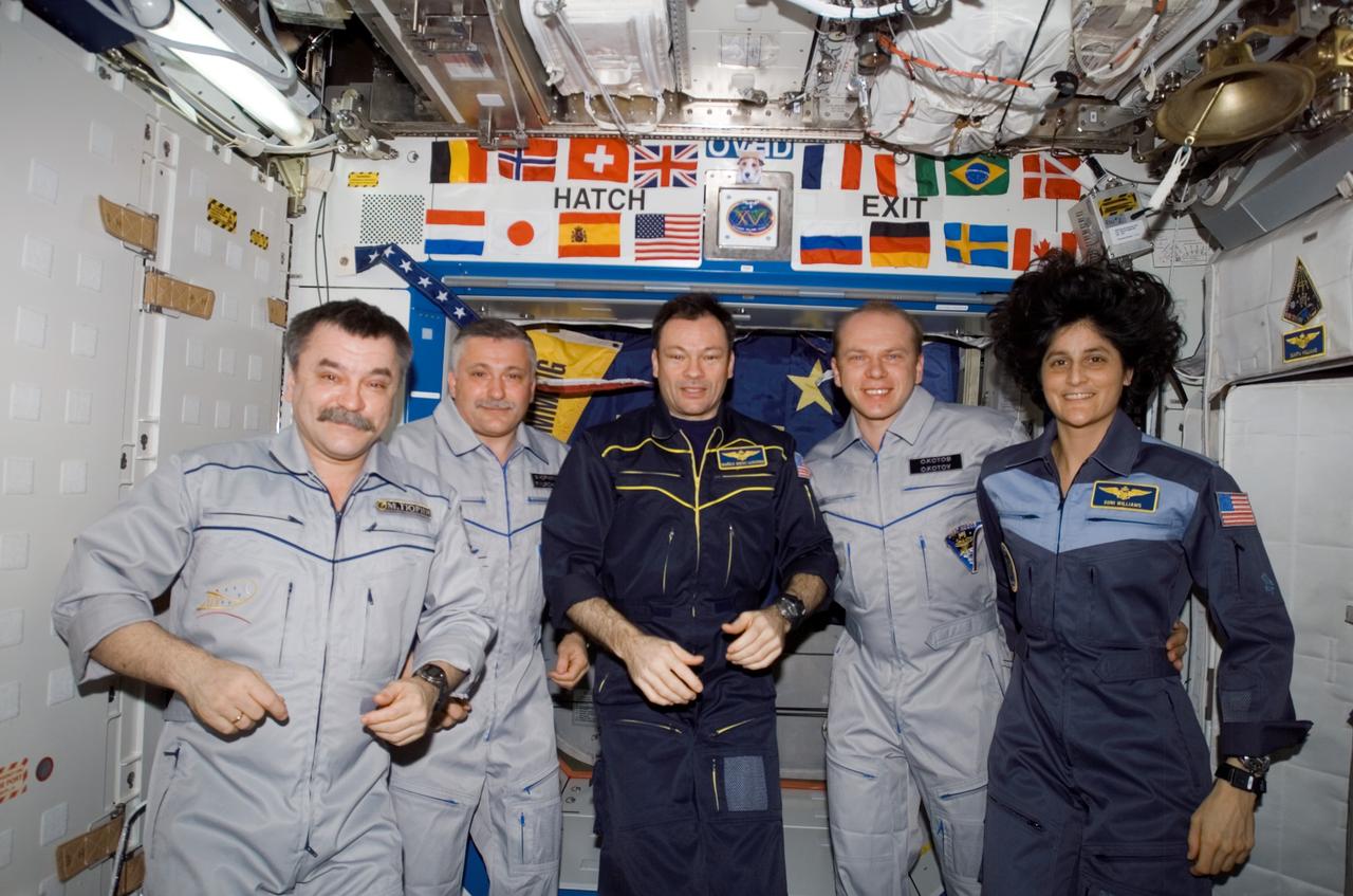 ISS014-E-19535 (17 April 2007) --- The crewmembers onboard the International Space Station pose for a group portrait during the ceremony of Changing-of-Command from Expedition 14 to Expedition 15 in the Destiny laboratory. From the left are cosmonauts Mikhail Tyurin, Expedition 14 flight engineer; Fyodor N. Yurchikhin, Expedition 15 commander; astronaut Michael E. Lopez-Alegria, Expedition 14 commander and NASA space station science officer; cosmonaut Oleg V. Kotov, Expedition 15 flight engineer; and astronaut Sunita L. Williams, Expedition 14/15 flight engineer. Tyurin, Yurchikhin and Kotov represent Russia's Federal Space Agency.
