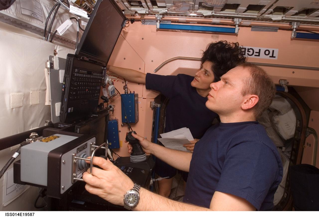 ISS014-E-19587 (17 April 2007) --- Cosmonaut Oleg V. Kotov (foreground), Expedition 15 flight engineer representing Russia's Federal Space Agency, and astronaut Sunita L. Williams, flight engineer, participate in a Space Station Remote Manipulator System (SSRMS) training session using the Robotic Onboard Trainer (ROBOT) simulator in the Unity node of the International Space Station.