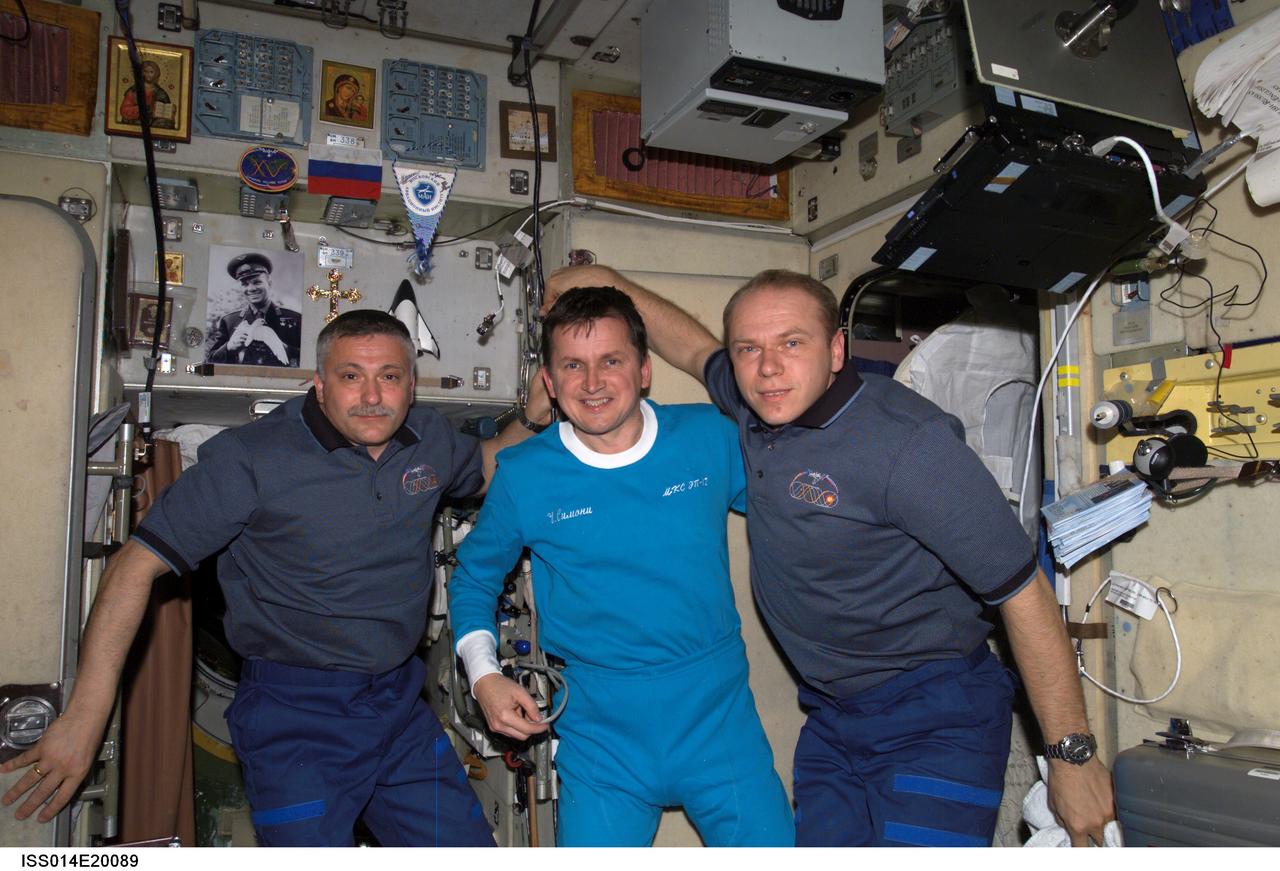 ISS014-E-20089 (21 April 2007) --- Cosmonaut Fyodor N. Yurchikhin (left), Expedition 15 commander; U.S. spaceflight participant Charles Simonyi, and cosmonaut Oleg V. Kotov, flight engineer, pause for a photograph in the Zvezda Service Module of the International Space Station during preparations for Simonyi's return to Earth. Yurchikhin and Kotov represent Russia's Federal Space Agency.