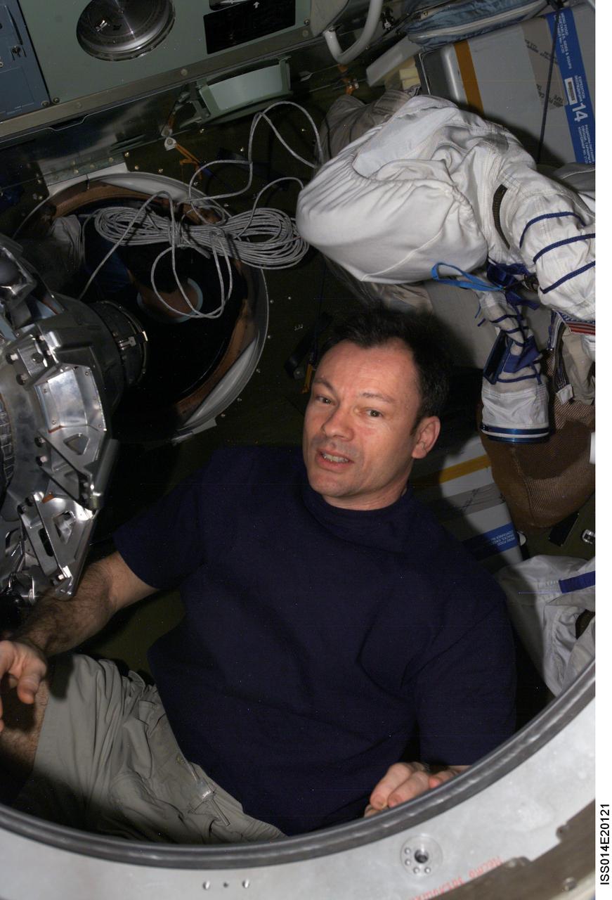 ISS014-E-20121 (21 April 2007) --- Astronaut Michael E. Lopez-Alegria, Expedition 14 commander and NASA space station science officer, photographed in a hatch of a Soyuz spacecraft docked to the International Space Station.