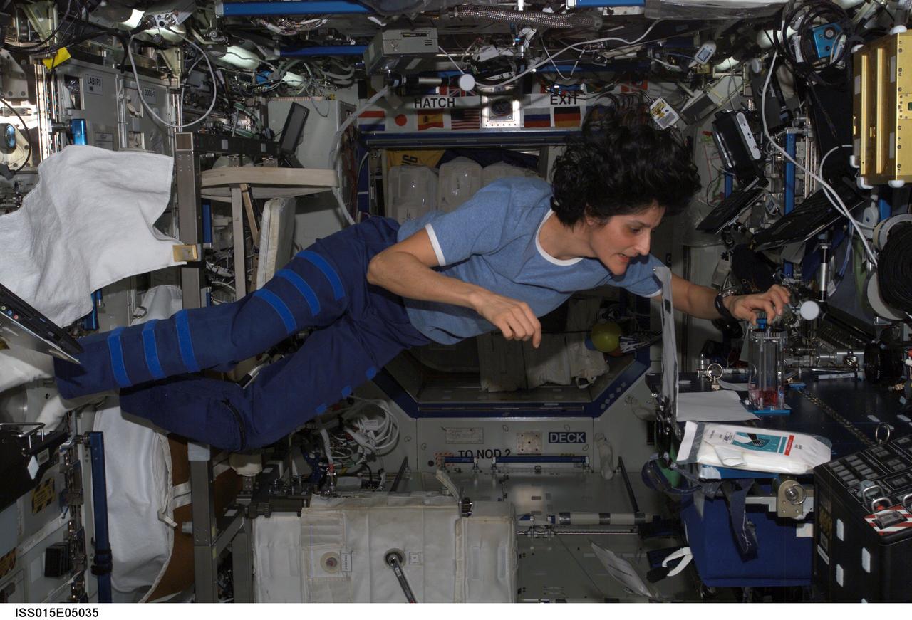ISS015-E-05035 (23 April 2007) --- Astronaut Sunita L. Williams, Expedition 15 flight engineer, performs one of multiple tests of the Capillary Flow Experiment (CFE) investigation in the Destiny laboratory of the International Space Station. CFE observes the flow of fluid, in particular capillary phenomena, in microgravity.