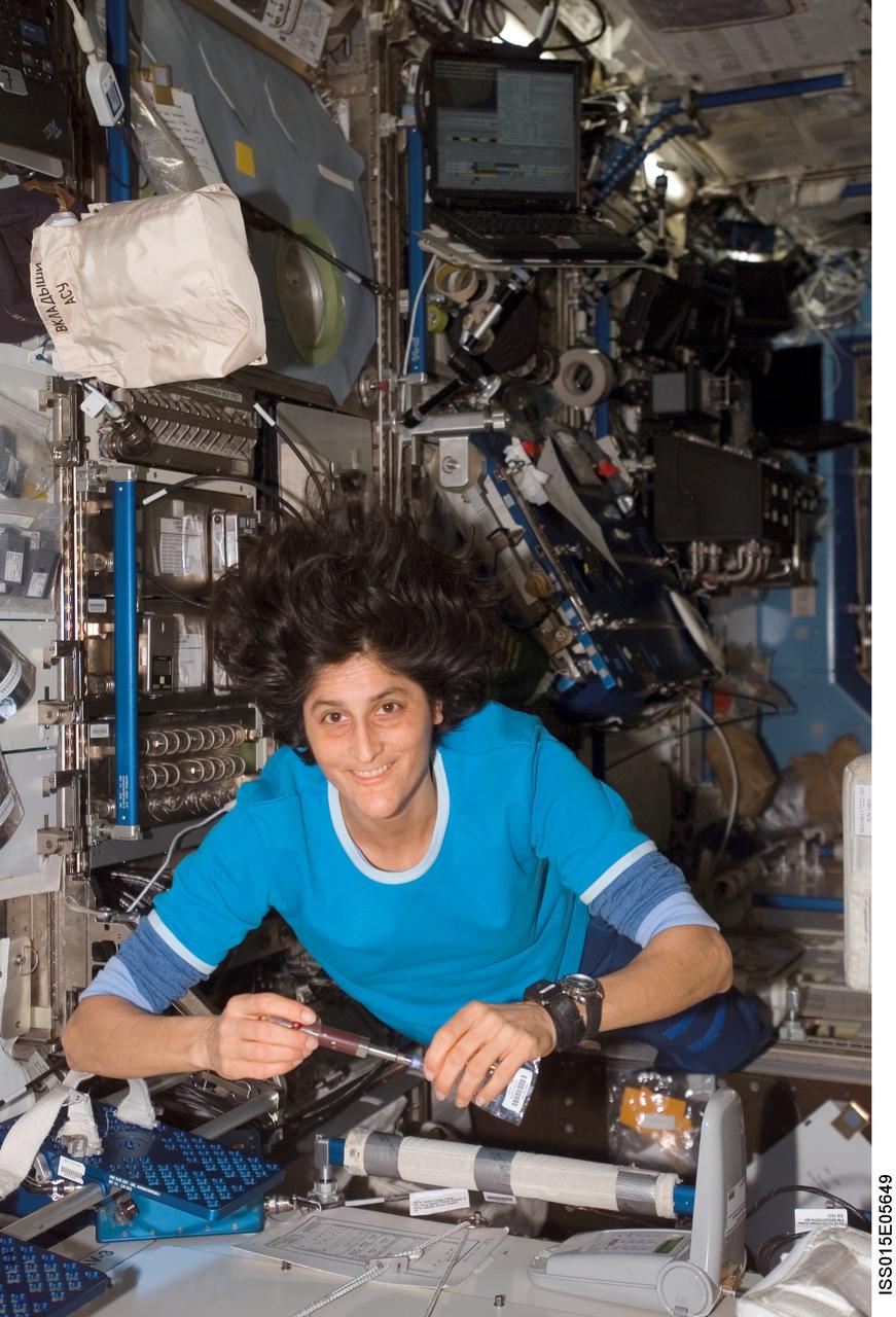 ISS015-E-05649 (30 April 2007) --- Astronaut Sunita L. Williams, Expedition 15 flight engineer, works with the Lab-on-a-Chip Application Development-Portable Test System (LOCAD-PTS) experiment in the Destiny laboratory of the International Space Station. LOCAD-PTS is a handheld device for rapid detection of biological and chemical substances onboard the station.