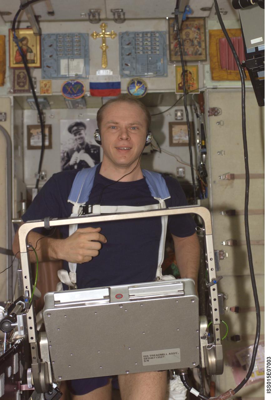 ISS015-E-07003 (6 May 2007) --- Cosmonaut Oleg V. Kotov, Expedition 15 flight engineer representing Russia's Federal Space Agency, equipped with a bungee harness, exercises on the Treadmill Vibration Isolation System (TVIS) in the Zvezda Service Module of the International Space Station.