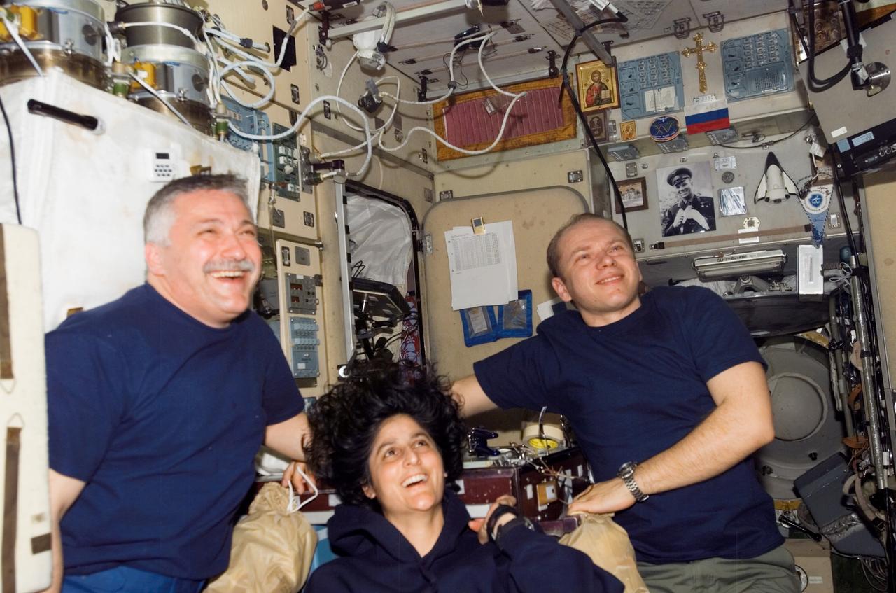 ISS015-E-08237 (27 April 2007) --- Cosmonauts Fyodor N. Yurchikhin (left), Oleg V. Kotov (right), Expedition 15 commander and flight engineer, respectively, and astronaut Sunita L. Williams, flight engineer, photographed during a teleconference in the Zvezda Service Module of the International Space Station.