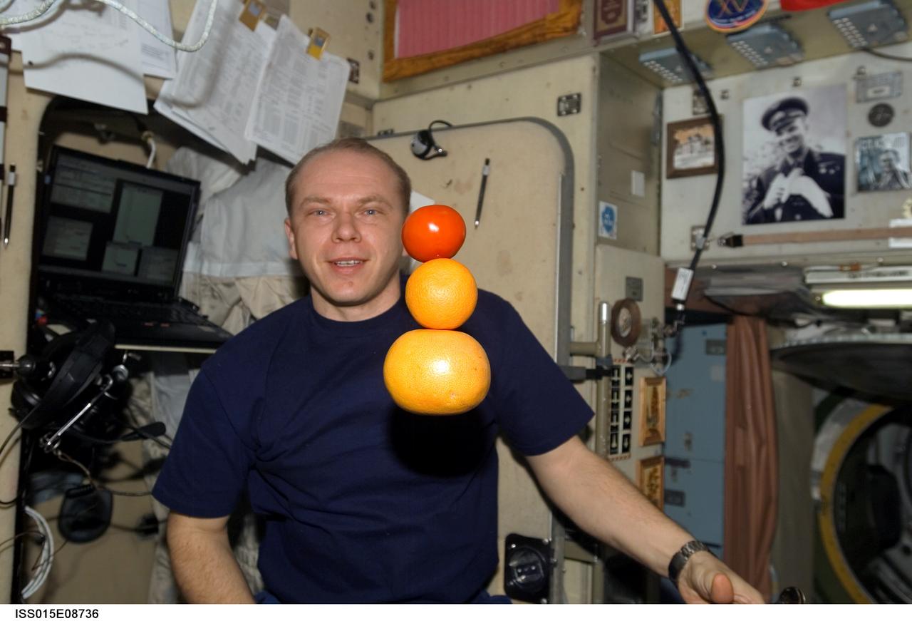 ISS015-E-08736 (19 May 2007) --- Cosmonaut Oleg V. Kotov, Expedition 15 flight engineer representing Russia's Federal Space Agency, is pictured near "fresh" fruit floating freely in the Zvezda Service Module of the International Space Station. The fruit was part of a recent delivery of food and supplies sent up via a Progress resupply craft.