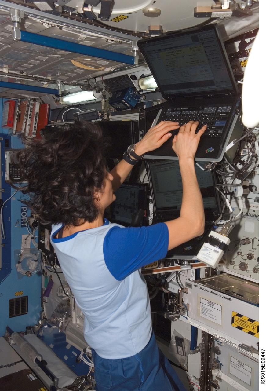 ISS015-E-09447 (24 May 2007) --- Astronaut Sunita L. Williams, Expedition 15 flight engineer, enters data in a computer for the Sleep-Wake Actigraphy and Light Exposure During Spaceflight-Long (Sleep-Long) experiment in the Destiny laboratory of the International Space Station. Sleep-Long will examine the effects of spaceflight and ambient light exposure on the sleep-wake cycles of the crewmembers during long-duration stays on the station.
