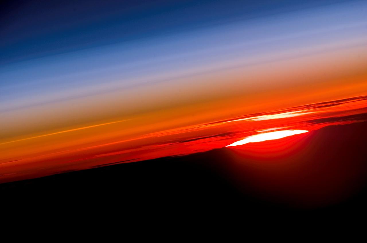 ISS015-E-10469 (3 June 2007) --- The profile of the atmosphere and a setting sun are featured in this image photographed by an Expedition 15 crewmember on the International Space Station.