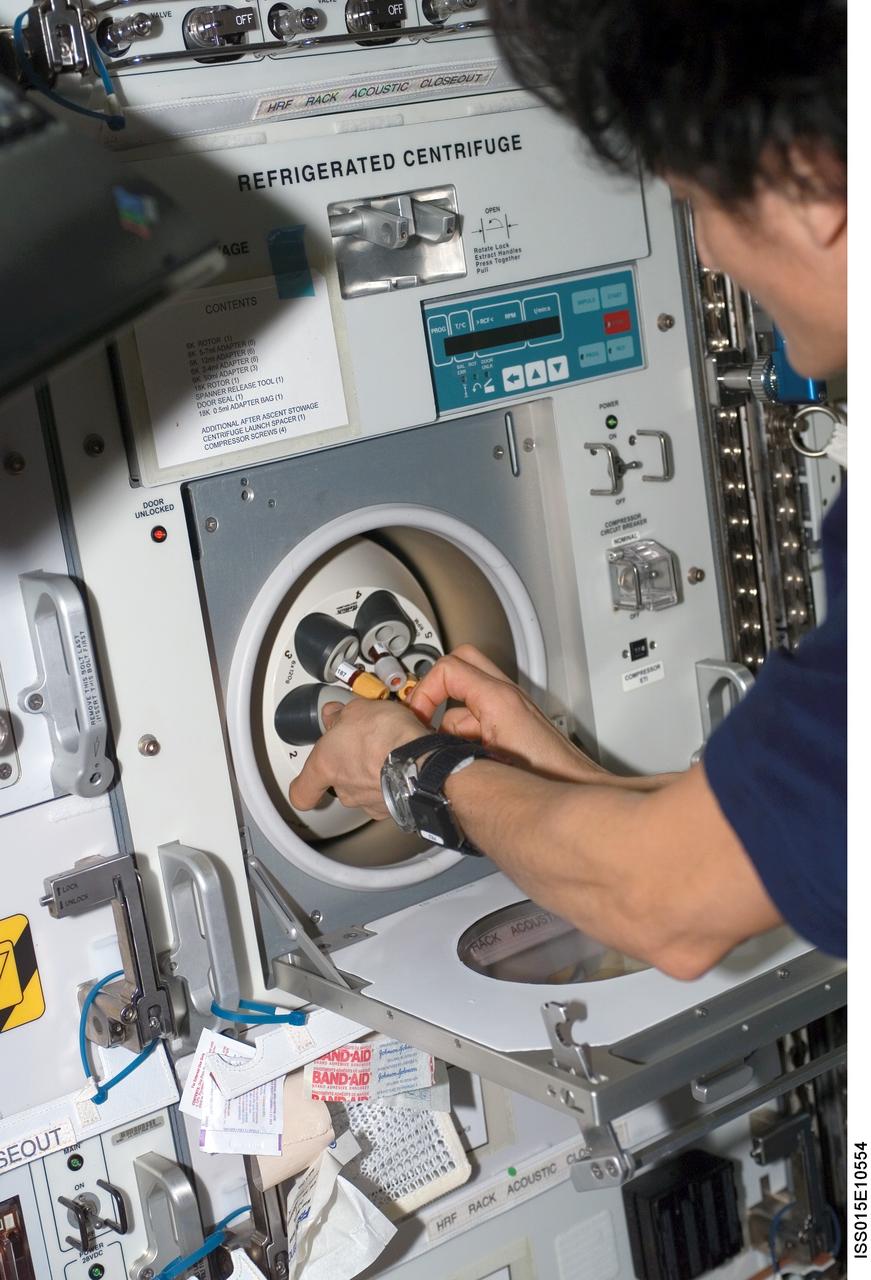 ISS015-E-10554 (1 June 2007) --- Astronaut Sunita L. Williams, Expedition 15 flight engineer, loads test samples in the Human Research Facility 2 (HRF-2) Refrigerated Centrifuge as a part of the Nutritional Status Assessment (Nutrition) experiment in the Destiny laboratory of the International Space Station. The results of the Nutrition experiment will be used to better understand the time course effects of space flight on human physiology.