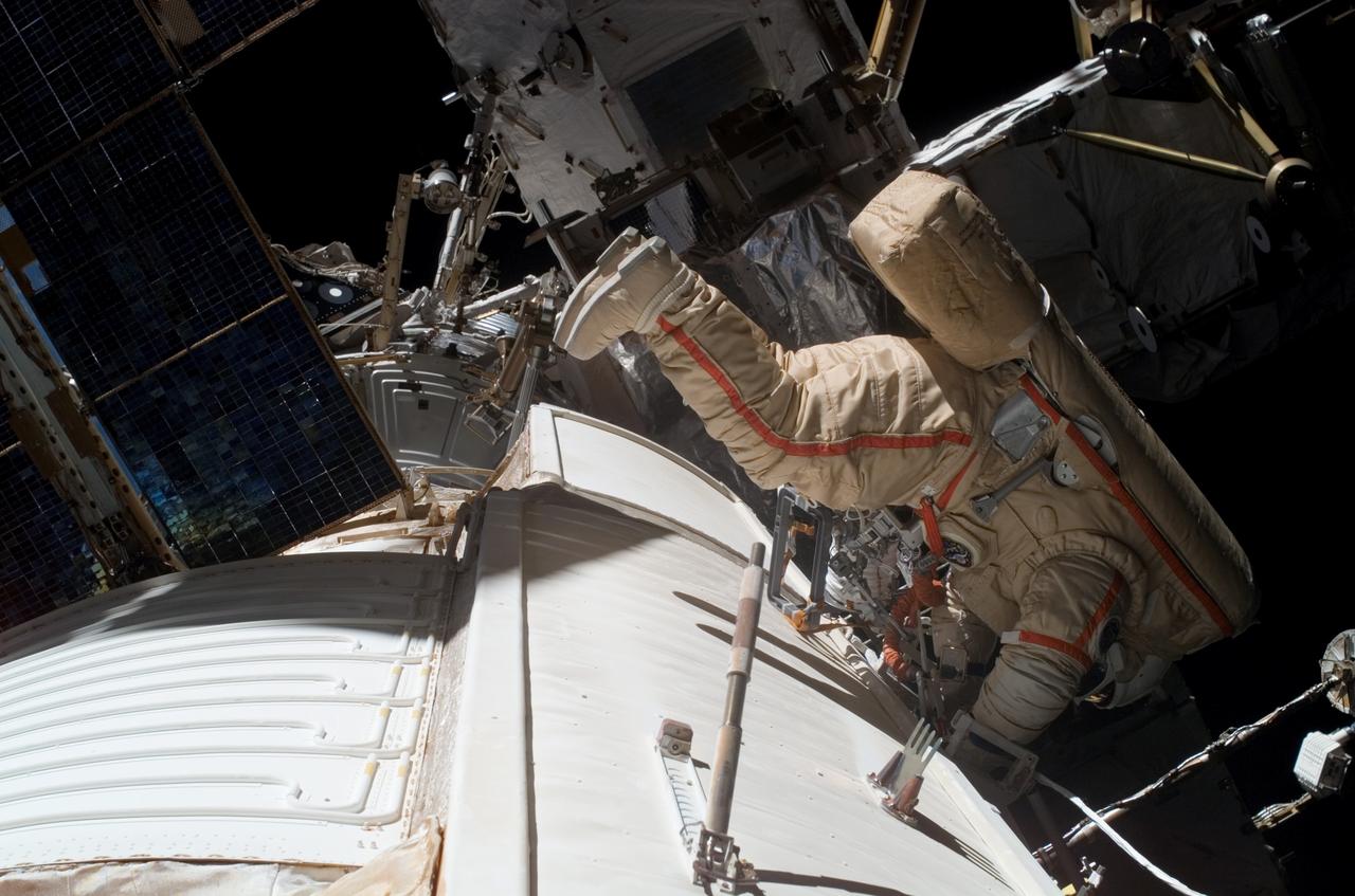 ISS015-E-10901 (6 June 2007) --- Cosmonaut Fyodor N. Yurchikhin, Expedition 15 commander representing Russia's Federal Space Agency, wearing a Russian Orlan spacesuit, participates in a session of extravehicular activity (EVA). Among other tasks, Yurchikhin and cosmonaut Oleg V. Kotov (out of frame), flight engineer representing Russia's Federal Space Agency, completed the installation of 12 more Zvezda Service Module debris panels and installed sample containers on the Pirs Docking Compartment for a Russian experiment, called Biorisk, which looks at the effect of space on microorganisms.
