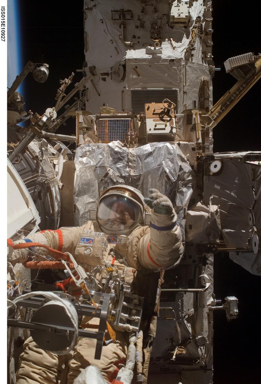 ISS015-E-10927 (6 June 2007) --- Cosmonaut Fyodor N. Yurchikhin, Expedition 15 commander representing Russia's Federal Space Agency, wearing a Russian Orlan spacesuit, participates in a session of extravehicular activity (EVA). Among other tasks, Yurchikhin and cosmonaut Oleg V. Kotov (out of frame), flight engineer representing Russia's Federal Space Agency, completed the installation of 12 more Zvezda Service Module debris panels and installed sample containers on the Pirs Docking Compartment for a Russian experiment, called Biorisk, which looks at the effect of space on microorganisms.