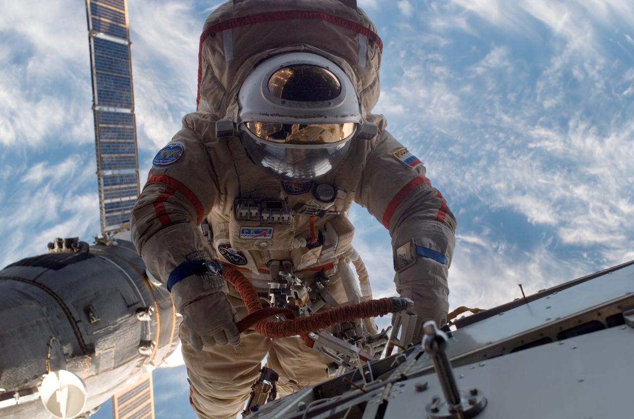 ISS015-E-11009 (6 June 2007) --- Cosmonaut Fyodor N. Yurchikhin, Expedition 15 commander representing Russia's Federal Space Agency, wearing a Russian Orlan spacesuit, participates in a session of extravehicular activity (EVA). Among other tasks, Yurchikhin and cosmonaut Oleg V. Kotov (out of frame), flight engineer representing Russia's Federal Space Agency, completed the installation of 12 more Zvezda Service Module debris panels and installed sample containers on the Pirs Docking Compartment for a Russian experiment, called Biorisk, which looks at the effect of space on microorganisms.