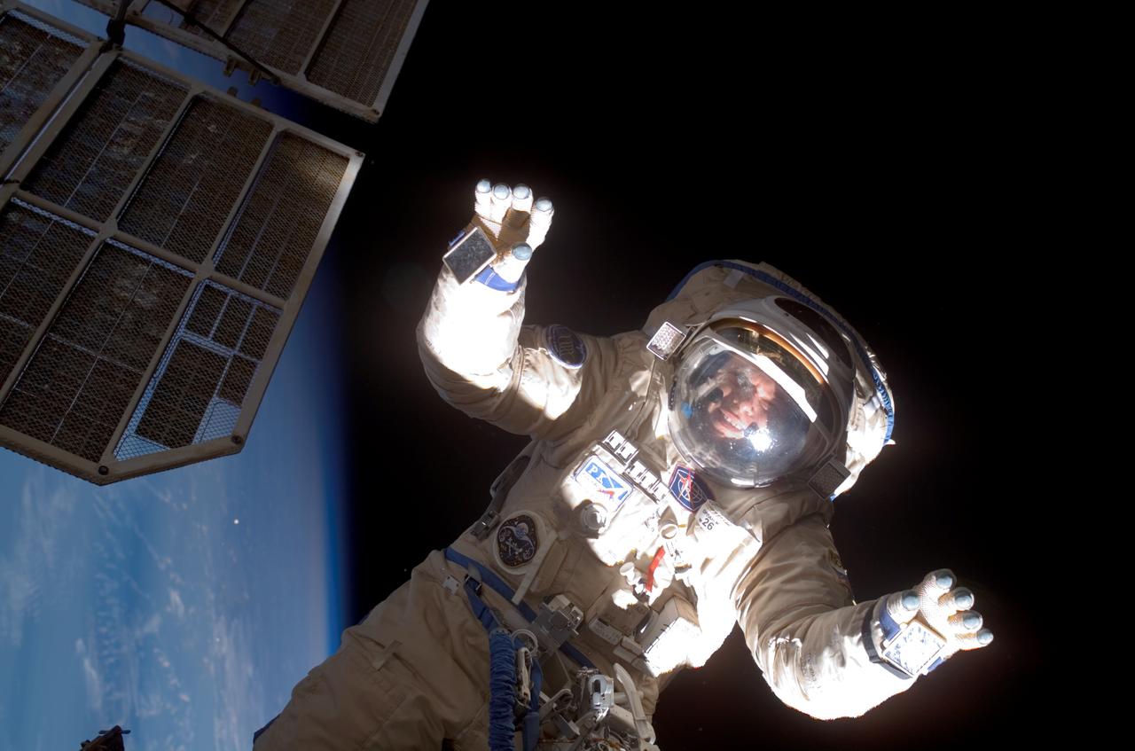 ISS015-E-11026 (6 June 2007) --- Cosmonaut Oleg V. Kotov, Expedition 15 flight engineer representing Russia's Federal Space Agency, wearing a Russian Orlan spacesuit, participates in a session of extravehicular activity (EVA). Among other tasks, Kotov and cosmonaut Fyodor N. Yurchikhin (out of frame), commander representing Russia's Federal Space Agency, completed the installation of 12 more Zvezda Service Module debris panels and installed sample containers on the Pirs Docking Compartment for a Russian experiment, called Biorisk, which looks at the effect of space on microorganisms.