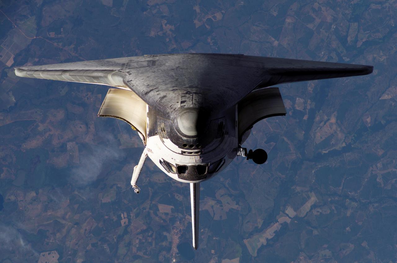 Atlantis and Payload on approach to the ISS during the STS-117 Mission