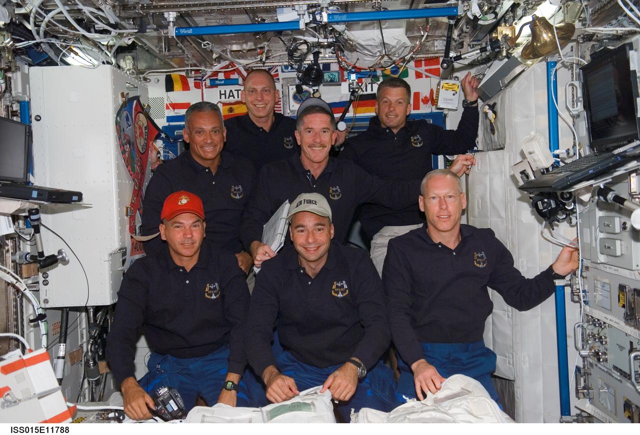 ISS015-E-11788 (10 June 2007) --- The STS-117 crewmembers pose for a portrait in the Destiny laboratory of the International Space Station shortly after Space Shuttle Atlantis docked with the station. From the left (front row) are astronauts Rick Sturckow, commander; Lee Archambault, pilot; and Patrick Forrester, mission specialist. From the left (back row) are astronauts John "Danny" Olivas, Clayton Anderson, Jim Reilly and Steven Swanson, all mission specialists.