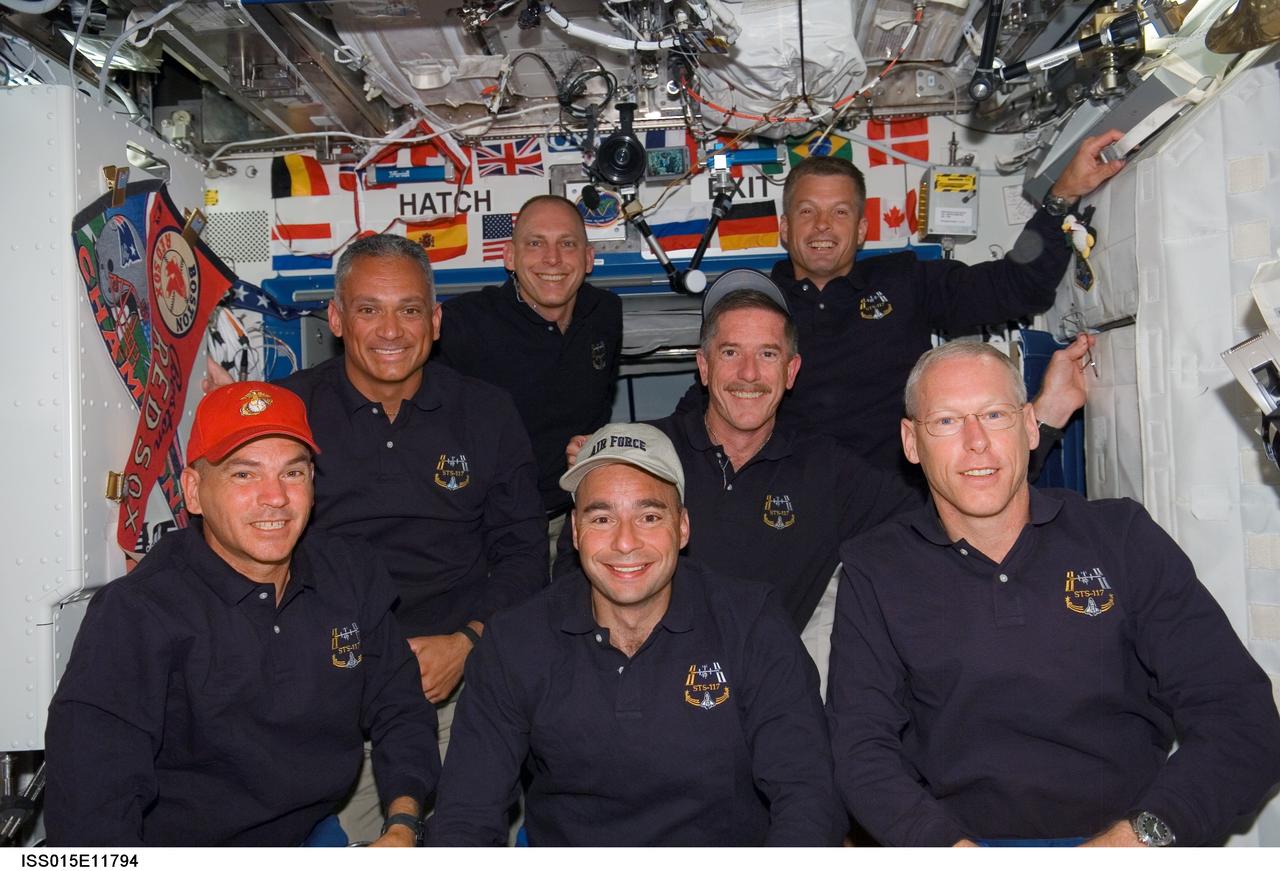 ISS015-E-11794 (10 June 2007) --- The STS-117 crewmembers pose for a portrait in the Destiny laboratory of the International Space Station shortly after Space Shuttle Atlantis docked with the station. From the left (front row) are astronauts Rick Sturckow, commander; Lee Archambault, pilot; and Patrick Forrester, mission specialist. From the left (back row) are astronauts John "Danny" Olivas, Clayton Anderson, Jim Reilly and Steven Swanson, all mission specialists.