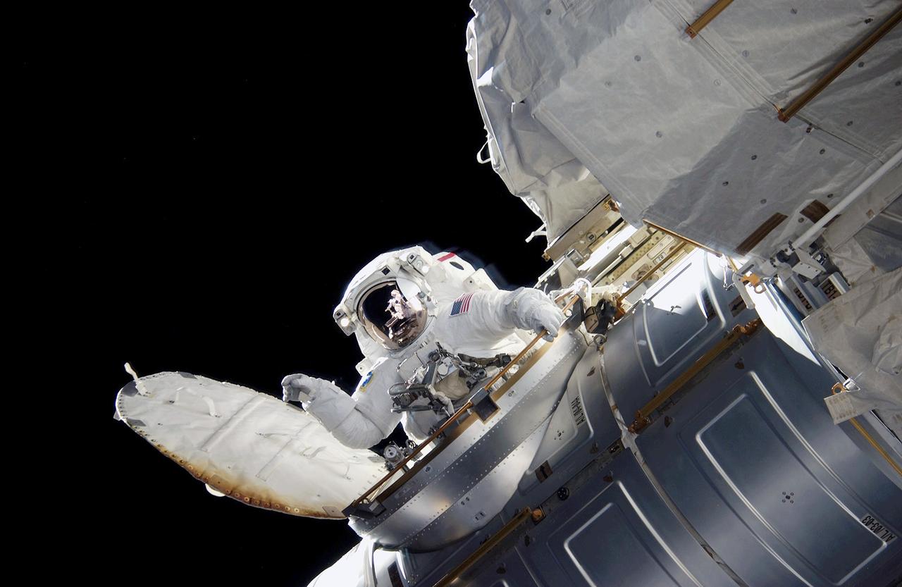 ISS015-E-12878 (15 June 2007) --- Astronaut Jim Reilly, STS-117 mission specialist, enters the Quest Airlock on the International Space Station at the conclusion of the mission's third scheduled session of extravehicular activity (EVA) while Space Shuttle Atlantis was docked with the station.
