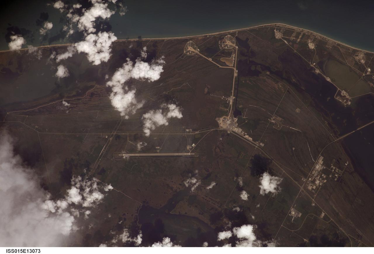 ISS015-E-13073 (20 June 2007) --- Kennedy Space Center and Cape Canaveral, Florida are featured in this image photographed by an Expedition 15 crewmember on the International Space Station. Launch complex 39, with pads A and B, is visible at top center. The Vehicle Assembly Building (VAB) is visible near center. The Shuttle Landing Facility appears as a long thin strip just below center.
