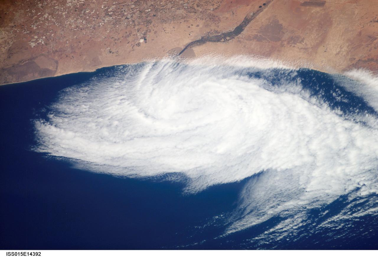 ISS015-E-14392 (26 June 2007) --- This nadir view from the International Space Station, photographed at 11:43 GMT on June 26, 2007, shows a weak low pressure area off the coast of Morocco, just south of Agadir (out of frame), near the Oued Massa River at about 30 degrees north latitude and 9.5 degrees west longitude. A low pressure area like this can be caused either by the winds forming an eddy due to some land feature or a heat low has drifted off the coast.
