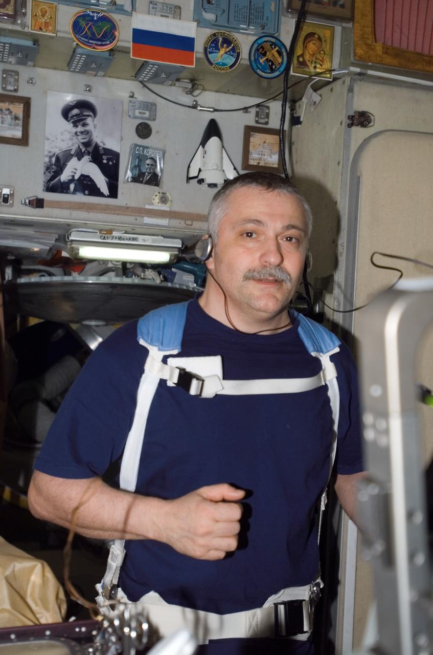 ISS015-E-17639 (4 July 2007) --- Cosmonaut Fyodor N. Yurchikhin, Expedition 15 commander representing Russia's Federal Space Agency, equipped with a bungee harness, exercises on the Treadmill Vibration Isolation System (TVIS) in the Zvezda Service Module of the International Space Station.