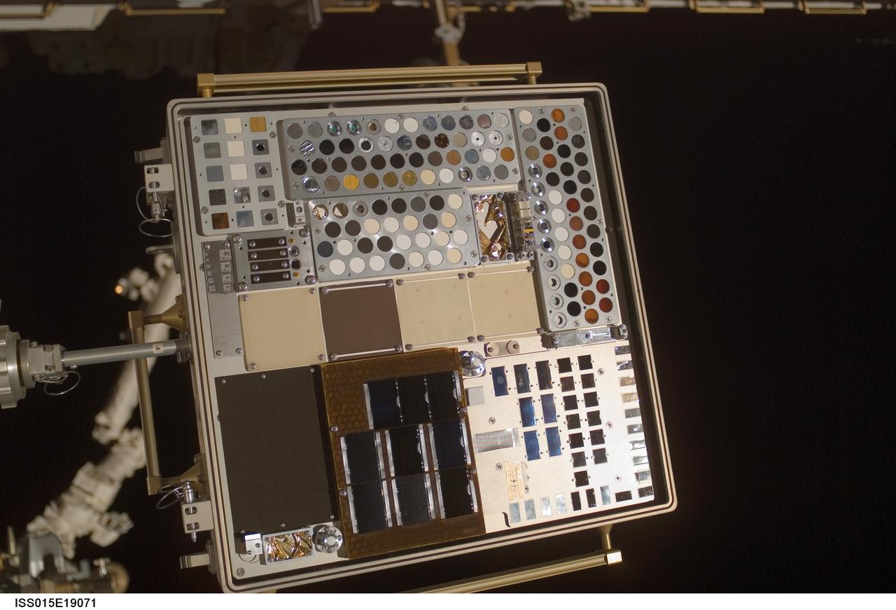 iss015e19071 (7/23/2007) --- View of Materials International Space Station Experiment (MISSE) Passive Experiment Container (PEC) mounted to the exterior of the Quest/Airlock (A/L). Photo taken during a session of Extravehicular Activity (EVA) on Expedition 15. Materials on the International Space Station Experiment 3 and 4 (MISSE - 3 and 4) are the third and fourth in a series of five suitcase-sized test beds attached to the outside of the space station. The beds were deployed during a spacewalk by the station crew in August 2006. They are exposing hundreds of potential space construction materials and different types of solar cells to the harsh environment of space. Mounted to the space station for about a year, the equipment then will be returned to Earth for study. Investigators will use the resulting data to design stronger, more durable spacecraft.