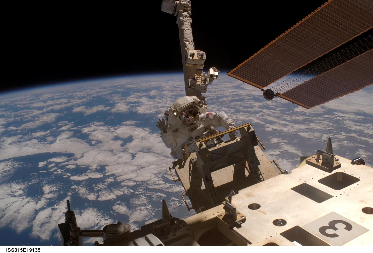 ISS015-E-19135 (23 July 2007) --- Anchored to the Canadarm2 foot restraint, astronaut Clay Anderson, Expedition 15 flight engineer, removes the Early Ammonia Servicer (EAS) from its place on the International Space Station during a session of extravehicular activity (EVA). Anderson later jettisoned the EAS by shoving it opposite of the station's direction of travel. The EAS was installed on the P6 truss during STS-105 in August 2001, as an ammonia reservoir if a leak had occurred. It was never used, and was no longer needed after the permanent cooling system was activated last December. The blackness of space and Earth's horizon provide the backdrop for the scene.