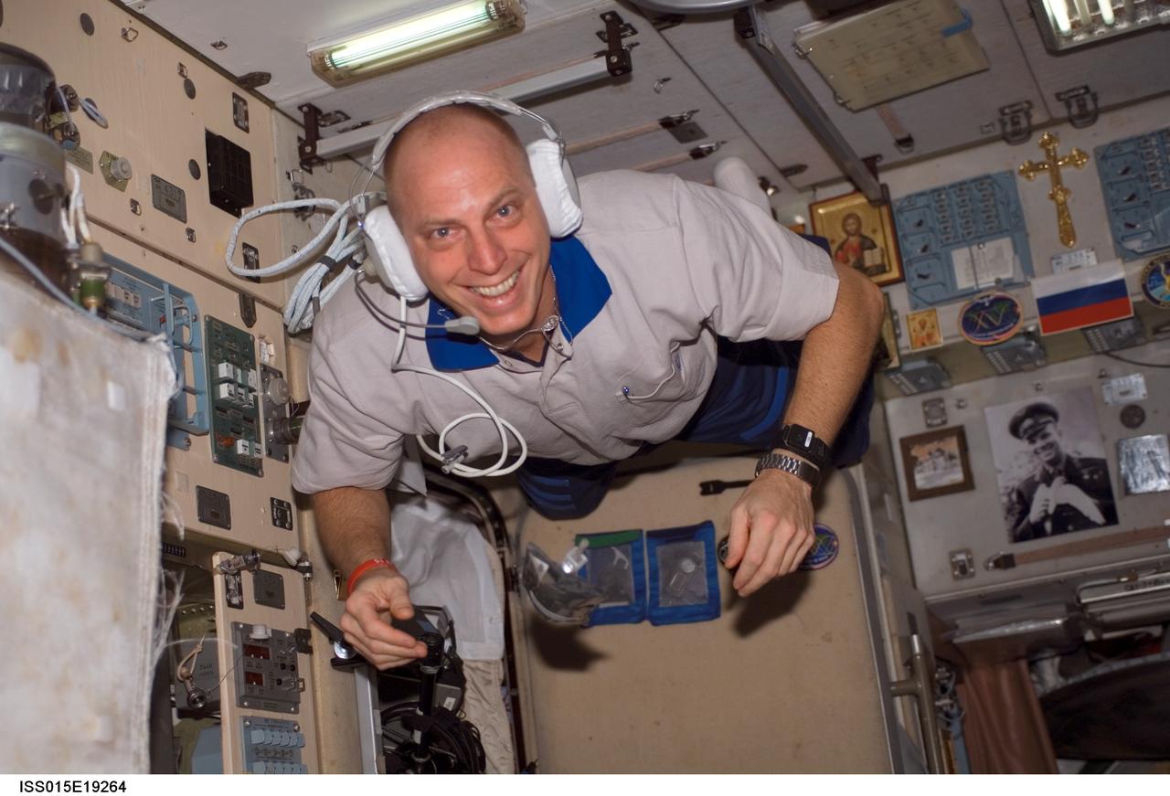 ISS015-E-19264 (24 July 2007) --- Astronaut Clay Anderson, Expedition 15 flight engineer, wearing communication headgear, smiles for the camera as he floats in the Zvezda Service Module of the International Space Station.