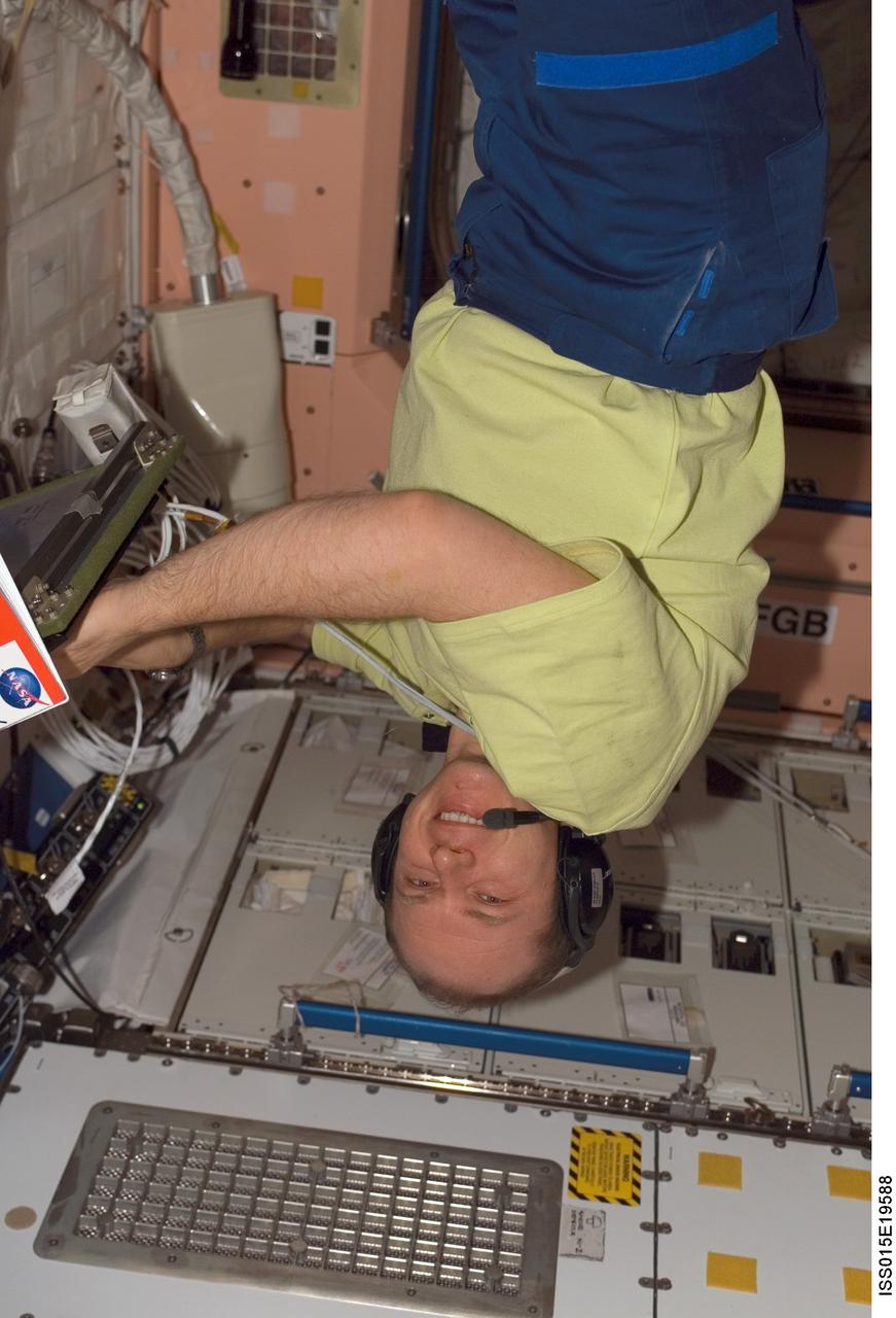 ISS015-E-19588 (25 July 2007) --- Cosmonaut Oleg V. Kotov, Expedition 15 flight engineer representing Russia's Federal Space Agency, wearing communication headgear, smiles for the camera as he floats in the Unity node of the International Space Station.