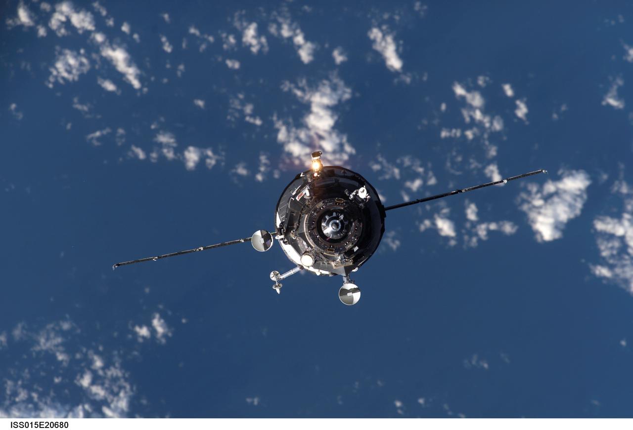 ISS015-E-20680 (5 Aug. 2007) --- Backdropped by a blue and white Earth, an unpiloted Progress supply vehicle approaches the International Space Station. The Progress 26 resupply craft launched at 12:34 p.m. (CDT) on Aug. 2, 2007 from the Baikonur Cosmodrome in Kazakhstan. Progress automatically docked to the Pirs Docking Compartment Sunday at 1:40 p.m. (CDT) on Aug. 5 delivering more than 2.5 tons of food, fuel, oxygen and other supplies to the Expedition 15 crewmembers onboard the station.