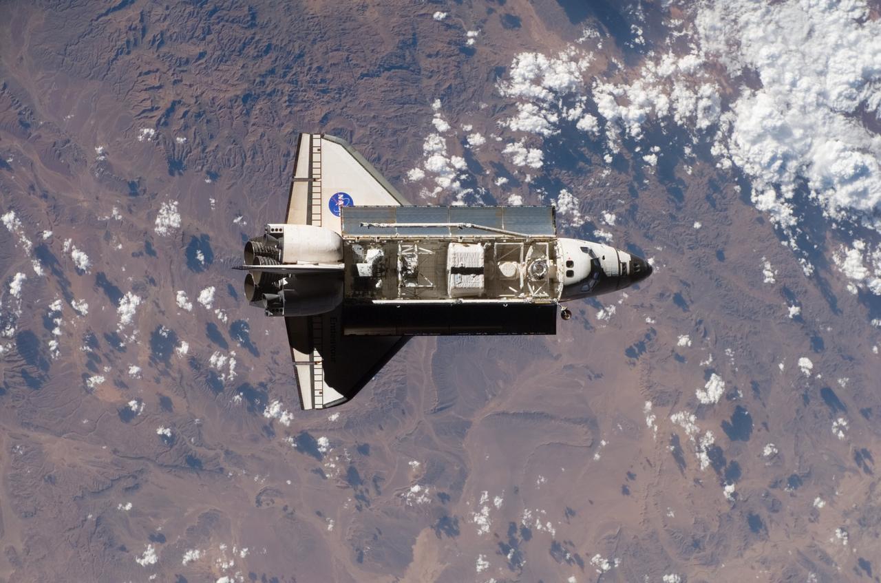 ISS015-E-21732 (10 Aug. 2007) --- This view of the Space Shuttle Endeavour, clearly shows its payload bay and upper surfaces. The image was photographed by one of the Expedition 15 crewmembers aboard the International Space Station shortly before the two vehicles docked in Earth orbit. Endeavour is contributing toward space station construction by delivering a third starboard truss segment, S5, and supplies inside the SPACEHAB module (in the center of the bay) and the external stowage platform 3.