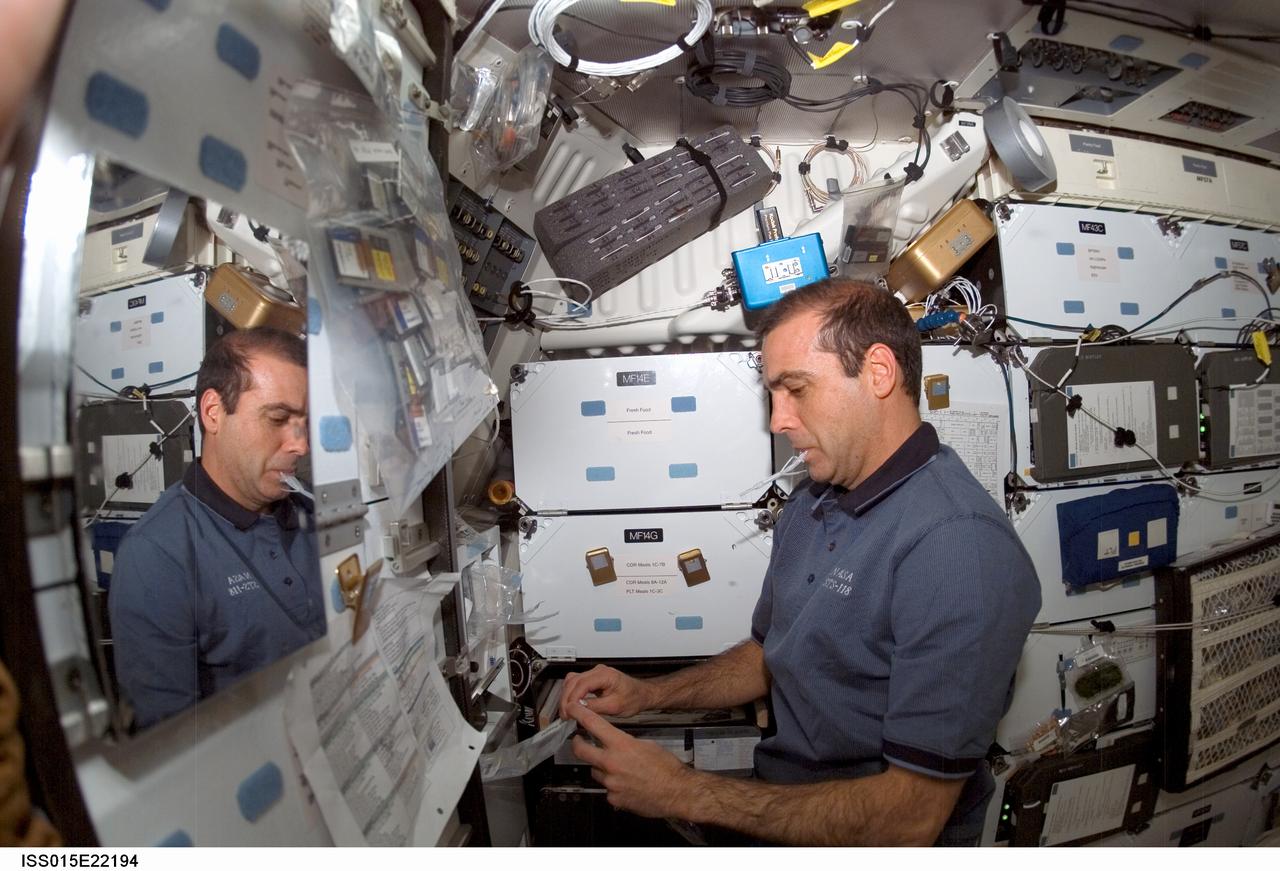 ISS015-E-22194 (12 Aug. 2007) --- Astronaut Rick Mastracchio, STS-118 mission specialist, prepares a beverage at the galley on the middeck of Space Shuttle Endeavour while docked with the International Space Station.