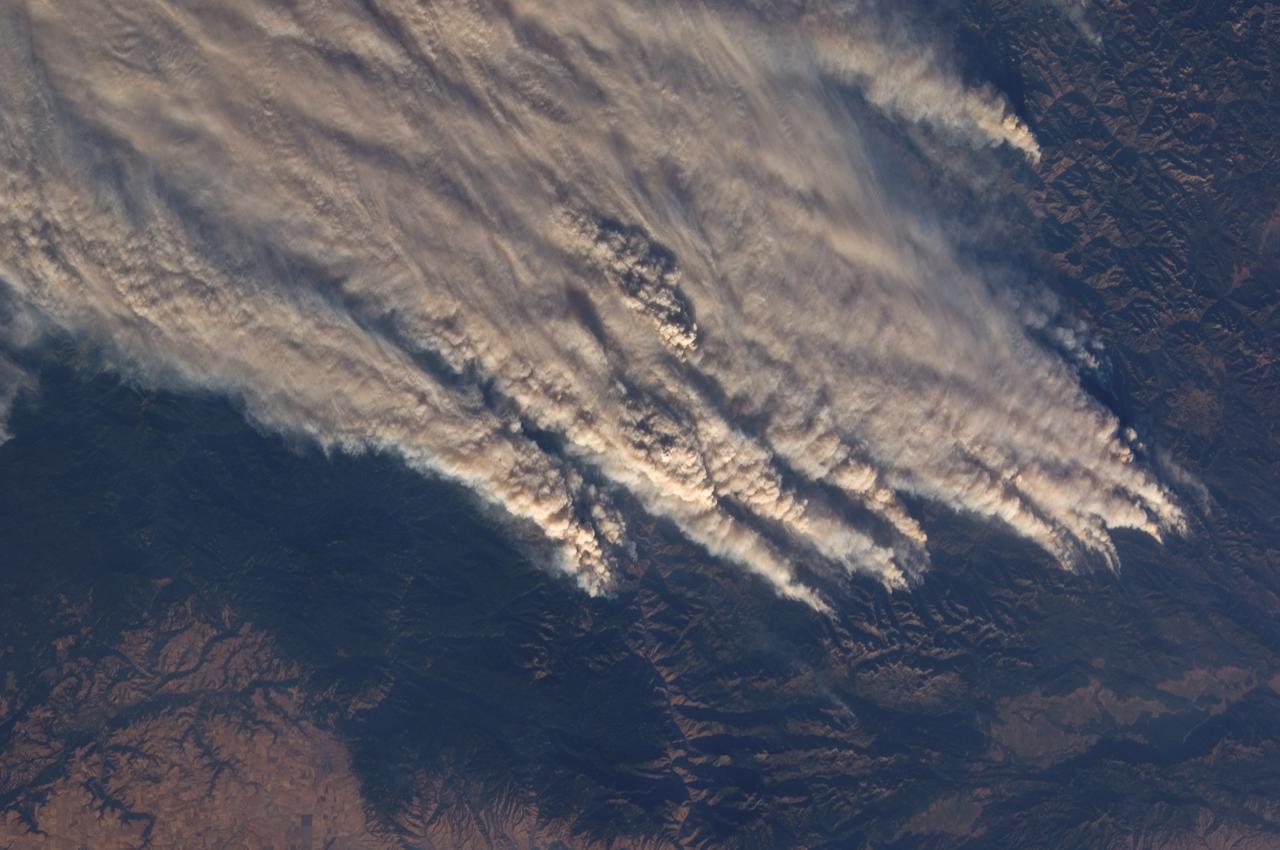 ISS015-E-22269 (13 Aug. 2007) --- The crew aboard the International Space Station provided this image of the wide-spread forest fires in the Payette National Forest, Central Idaho within the Salmon River Mountains. North is toward the left of the image. The Salmon River is the feature in the bottom central part of the frame. Lake Cascade is seen at the lower right.