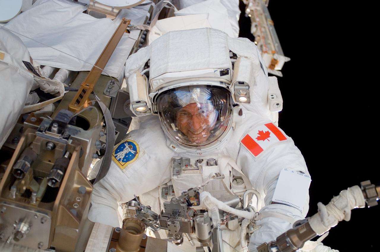 ISS015-E-22371 (13 Aug. 2007) --- Astronaut Dave Williams, STS-118 mission specialist representing the Canadian Space Agency, participates in the mission's second planned session of extravehicular activity (EVA) as construction and maintenance continue on the International Space Station. During the 6-hour, 28-minute spacewalk, Williams and astronaut Rick Mastracchio (out of frame), mission specialist, removed a faulty control moment gyroscope (CMG-3) and installed a new CMG into the station's Z1 truss. The failed CMG will remain at its temporary stowage location on the station's exterior until it is returned to Earth on a later shuttle mission. The new gyroscope is one of four CMGs that are used to control the station's attitude in orbit.