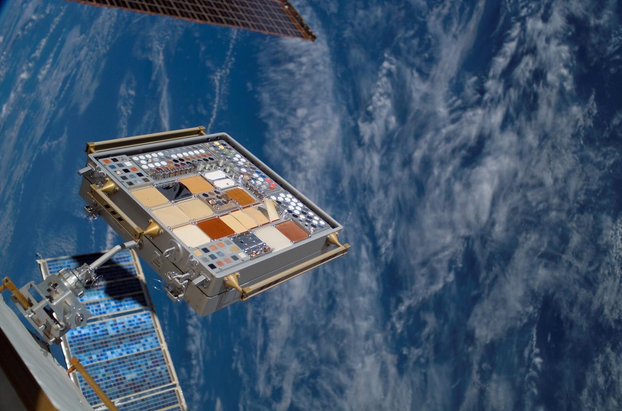 ISS015-E-22410 (13 Aug. 2007) --- Backdropped by a blue and white Earth, a Materials International Space Station Experiment (MISSE) on the exterior of the station is featured in this image photographed by a crewmember during the STS-118 mission's second planned session of extravehicular activity (EVA). MISSE collects information on how different materials weather in the environment of space.