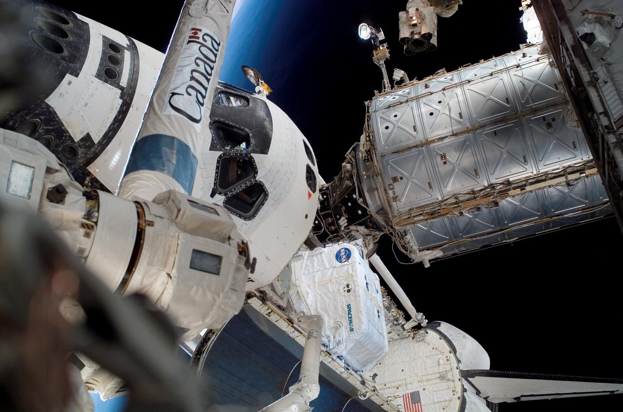 ISS015-E-22630 (15 Aug. 2007) --- Most of the surface elements of the Space Shuttle Endeavour are visible in this unique angle captured during the week's third spacewalk to perform work on the International Space Station. Parts of the shuttle and station's robot arms and the orbital boom sensor system arm are visible in the frame, as well as the SPACEHAB module in the middle of the Endeavour's payload bay.