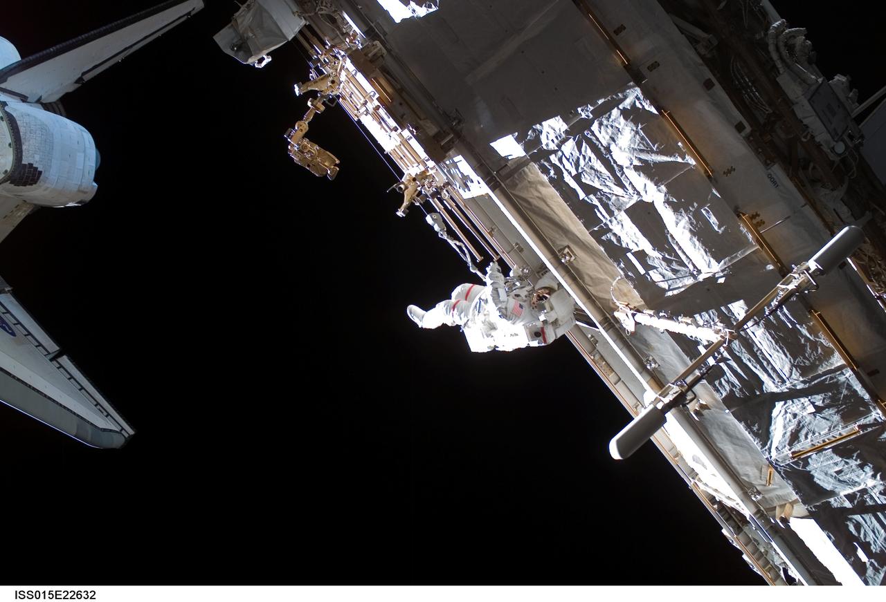 ISS015-E-22632 (15 Aug. 2007) --- Astronaut Rick Mastracchio, STS-118 mission specialist, participates in the mission's third planned session of extravehicular activity (EVA) as construction and maintenance continue on the International Space Station. During the 5-hour, 28-minute spacewalk, Mastracchio and astronaut Clay Anderson (out of frame), Expedition 15 flight engineer, relocated the S-Band Antenna Sub-Assembly from Port 6 (P6) to Port 1 (P1) truss, installed a new transponder on P1 and retrieved the P6 transponder.