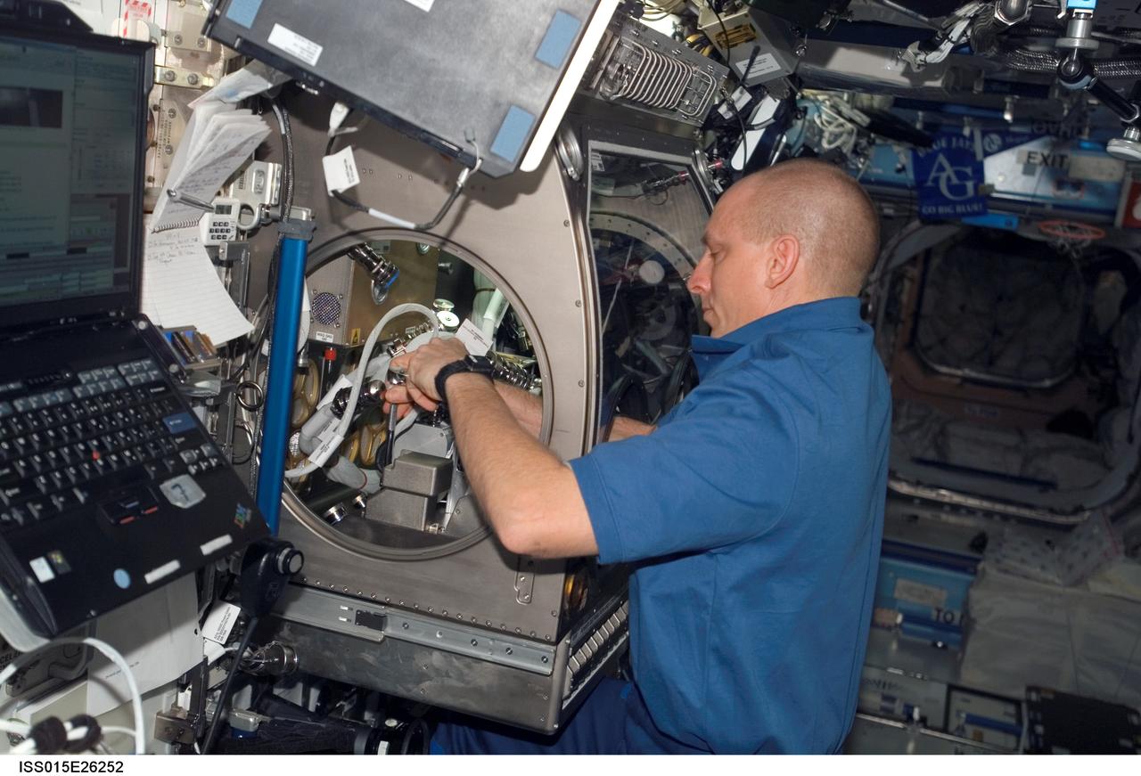 ISS015-E-26252 (1 Sept. 2007) --- Astronaut Clay Anderson, Expedition 15 flight engineer, works on the Smoke and Aerosol Measurement Experiment (SAME) hardware setup located in the Microgravity Science Glovebox (MSG) in the Destiny laboratory of the International Space Station. SAME will measure the smoke properties, or particle size distribution, of typical particles that are produced from different materials that can be found onboard station and other spacecrafts. SAME aims to test the performance of ionization smoke detectors and evaluate the performance of the photoelectric smoke detectors. The data will be used to develop a model that can predict smoke droplet growth that will be used to evaluate future smoke detection devices.
