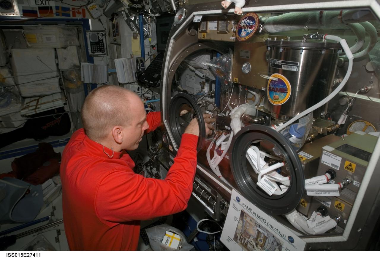 ISS015-E-27411 (8 Sept. 2007) --- NASA astronaut Clay Anderson, Expedition 15 flight engineer, works on the Smoke and Aerosol Measurement Experiment (SAME) hardware located in the Microgravity Science Glovebox (MSG) in the Destiny laboratory of the International Space Station. SAME will measure the smoke properties, or particle size distribution, of typical particles that are produced from different materials that can be found onboard station and other spacecrafts. SAME aims to test the performance of ionization smoke detectors and evaluate the performance of the photoelectric smoke detectors. The data will be used to develop a model that can predict smoke droplet growth that will be used to evaluate future smoke detection devices.