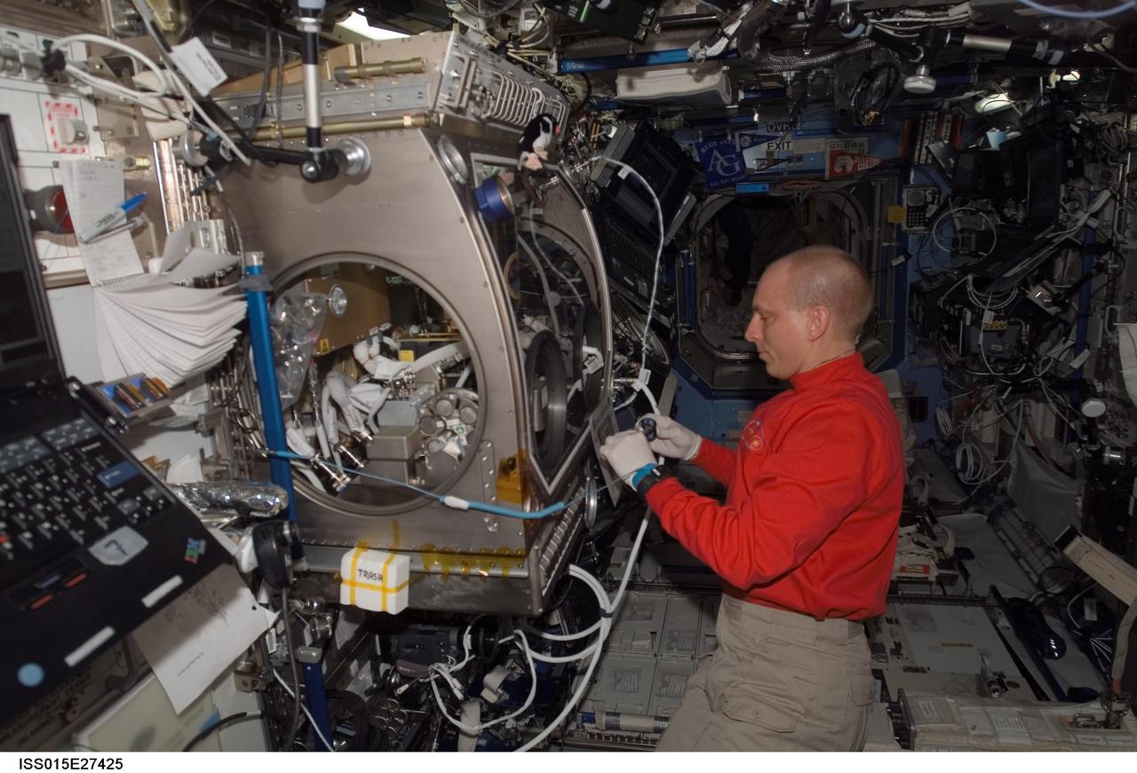 ISS015-E-27425 (8 Sept. 2007) --- NASA astronaut Clay Anderson, Expedition 15 flight engineer, works on the Smoke and Aerosol Measurement Experiment (SAME) hardware located in the Microgravity Science Glovebox (MSG) in the Destiny laboratory of the International Space Station. SAME will measure the smoke properties, or particle size distribution, of typical particles that are produced from different materials that can be found onboard station and other spacecrafts. SAME aims to test the performance of ionization smoke detectors and evaluate the performance of the photoelectric smoke detectors. The data will be used to develop a model that can predict smoke droplet growth that will be used to evaluate future smoke detection devices.