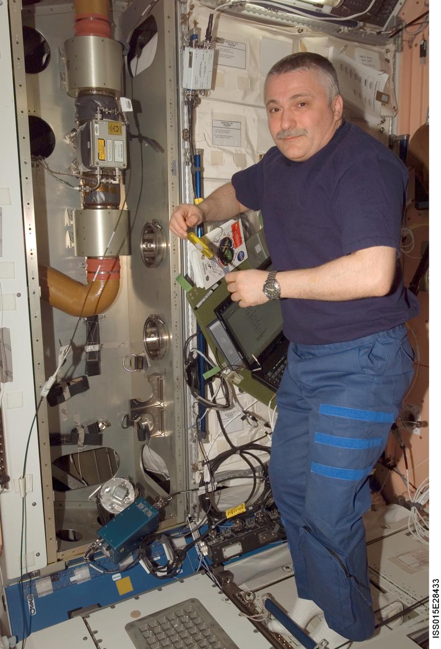 Yurchikhin poses for a photo while working in the Node 1