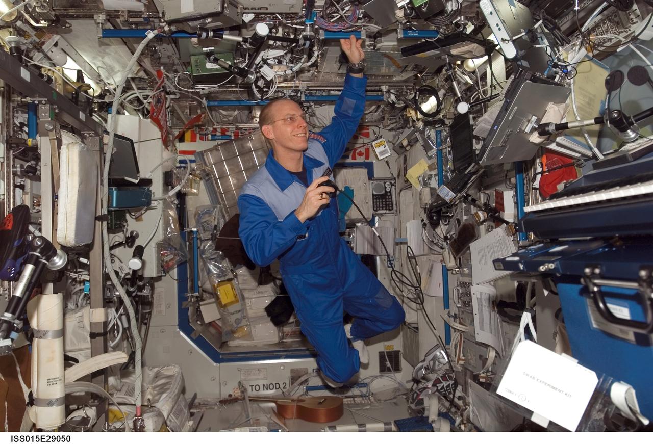 ISS015-E-29050 (16 Sept. 2007) --- Astronaut Clay Anderson, Expedition 15 flight engineer, uses a communication system in the Destiny laboratory of the International Space Station.