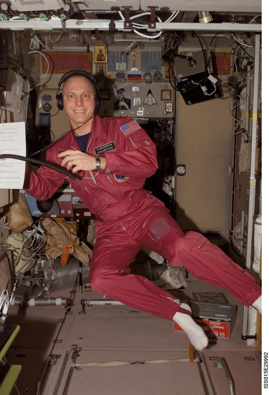 ISS015-E-29992 (26 Sept. 2007) --- Astronaut Clay Anderson, Expedition 15 flight engineer, smiles for a photo while using a communication system in the Zvezda Service Module of the International Space Station.