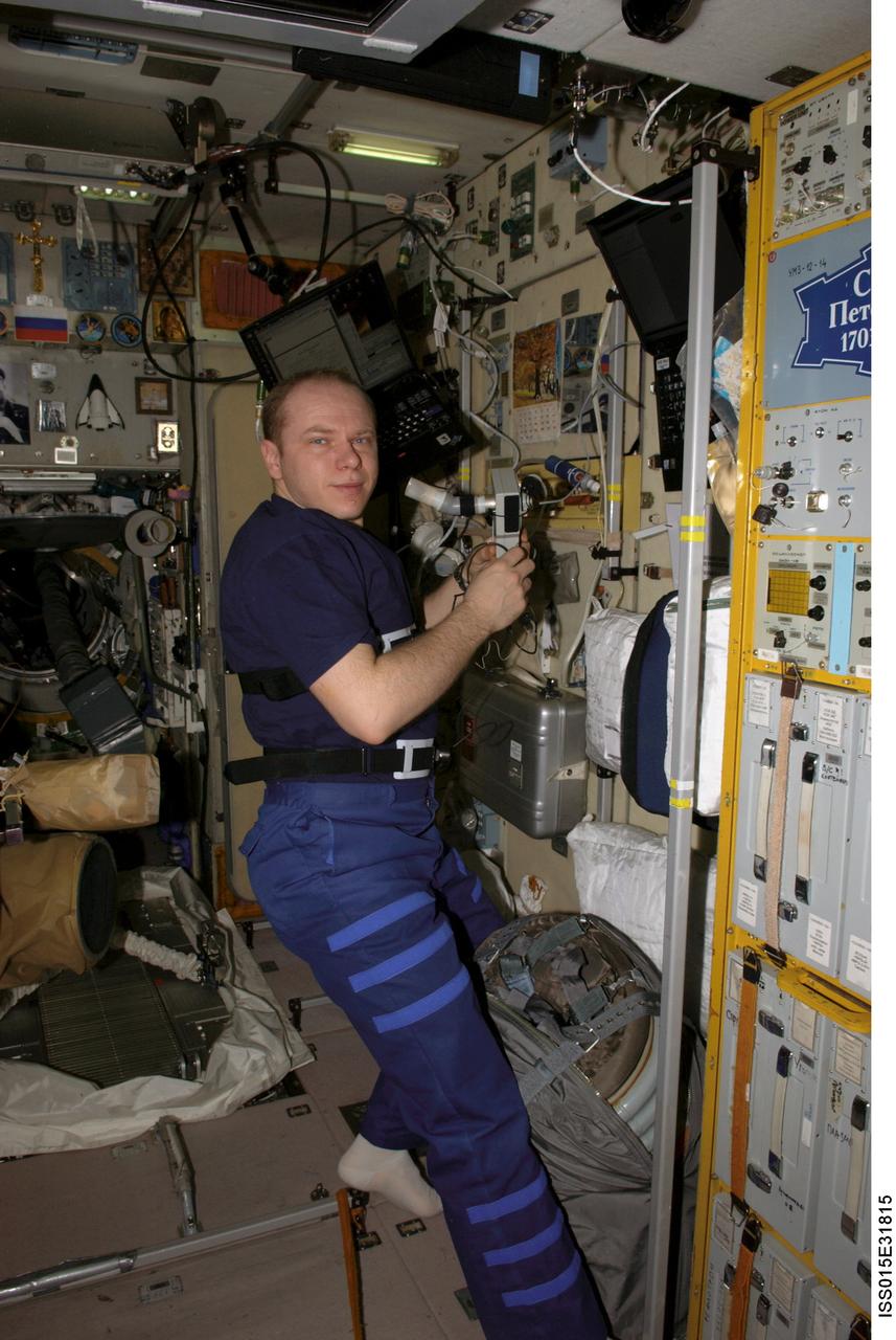ISS015-E-31815 (4 Oct. 2007) --- Cosmonaut Oleg V. Kotov, Expedition 15 flight engineer representing Russia's Federal Space Agency, works on a respiration experiment in the Zvezda Service Module of the International Space Station.
