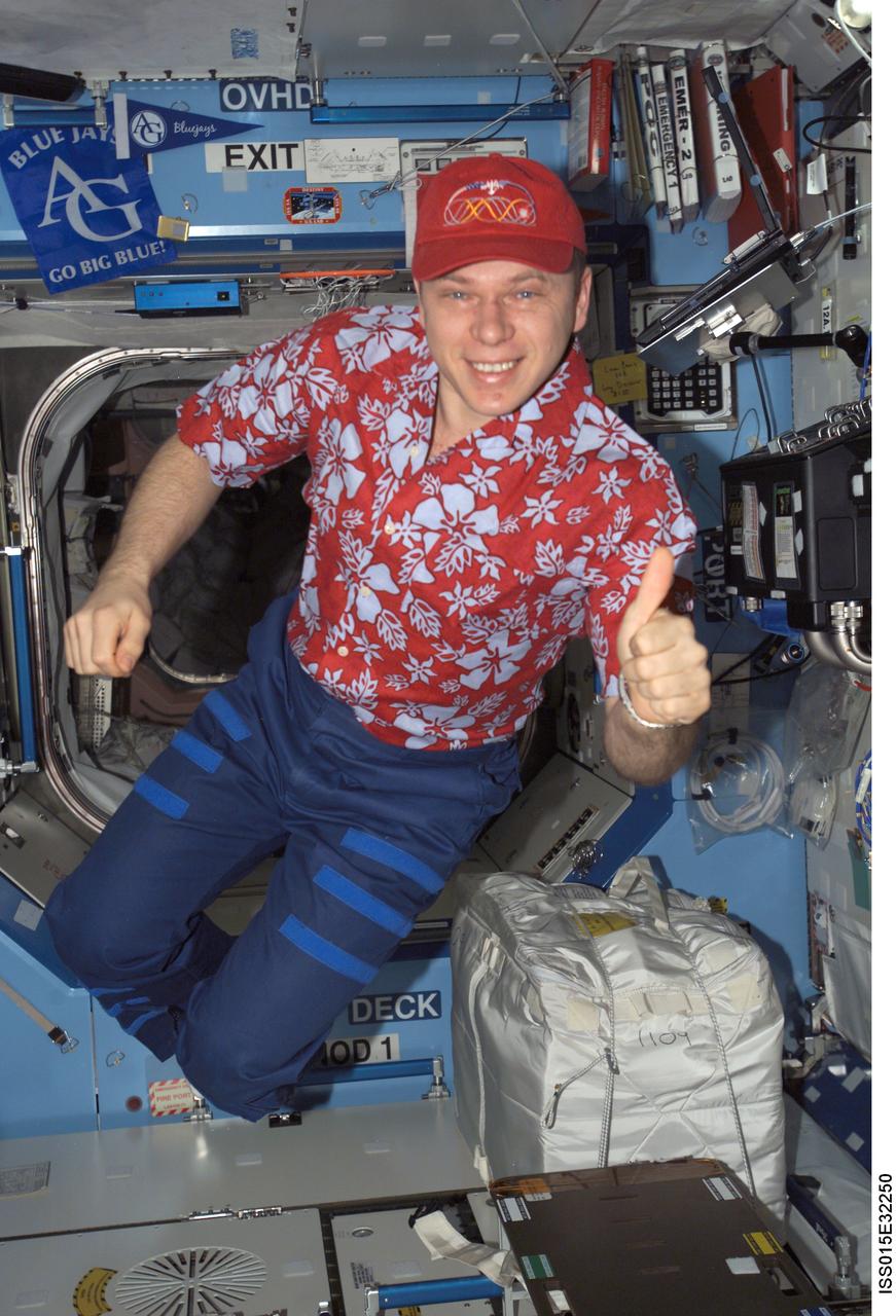 ISS015-E-32250 (7 Oct. 2007) --- Cosmonaut Oleg V. Kotov, Expedition 15 flight engineer representing Russia's Federal Space Agency, gives a "thumbs-up" signal while floating in the Destiny laboratory of the International Space Station.