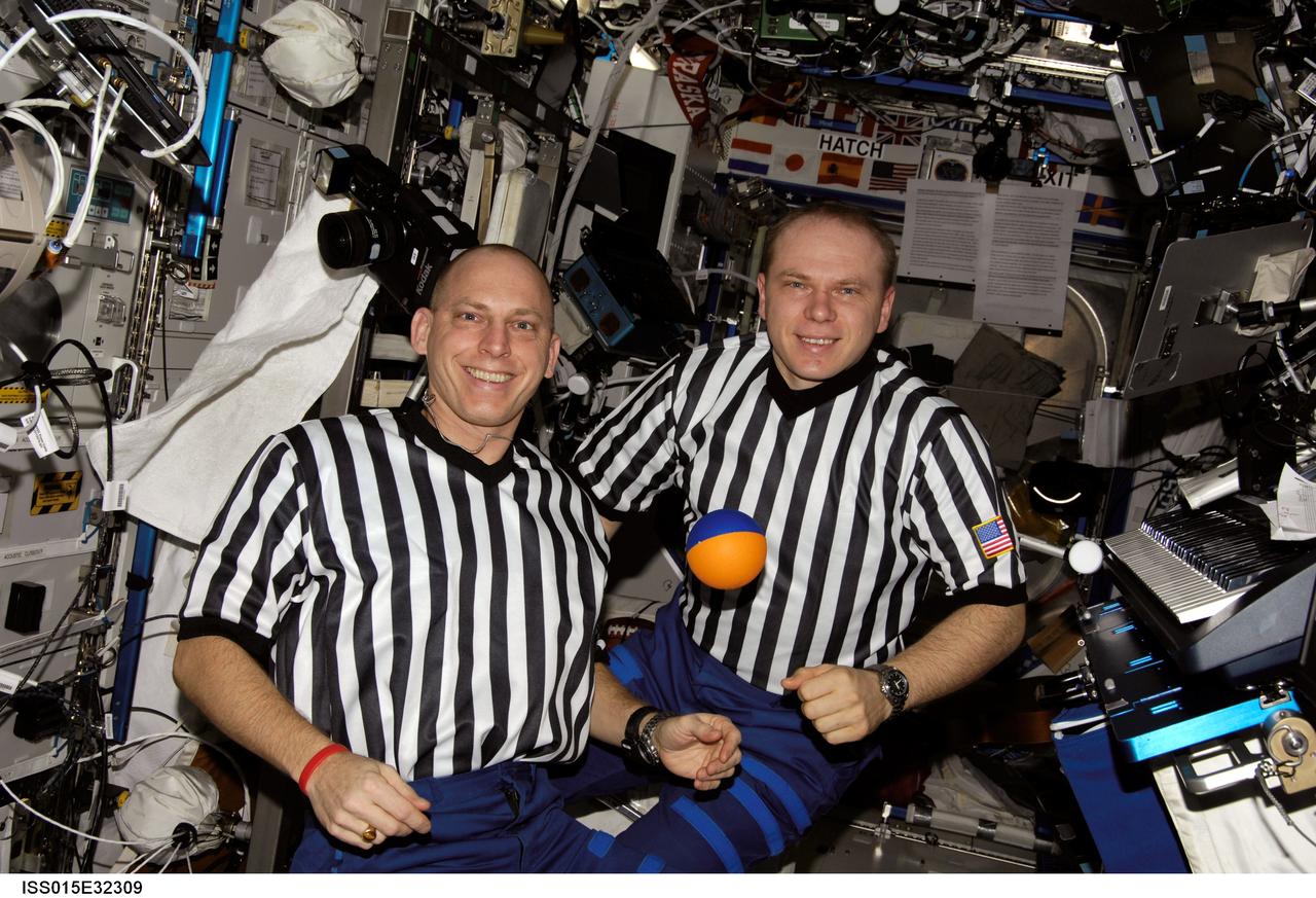 ISS015-E-32309 (October 2007) --- NASA astronaut Clay Anderson (left) and Russian Federal Space Agency cosmonaut Oleg V. Kotov, both Expedition 15 flight engineers, pose for a photo in the Destiny laboratory of the International Space Station.