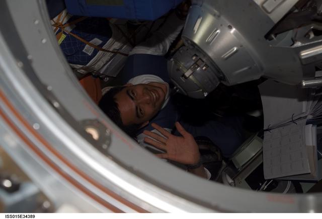 NASA image: View of Spaceflight Participant Shukor exiting the docked Soyuz