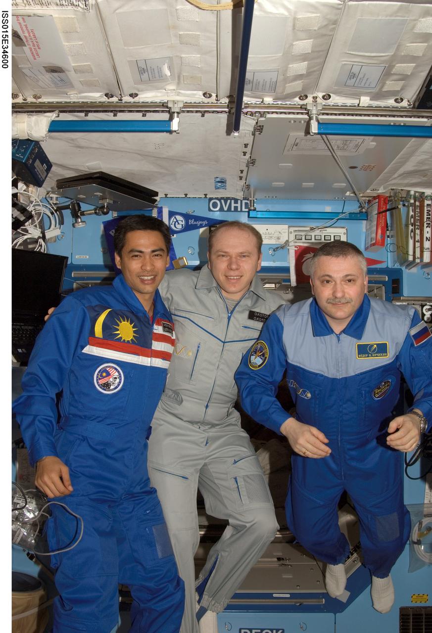 ISS015-E-34600 (16 Oct. 2007) --- Cosmonauts Fyodor N. Yurchikhin (right) and Oleg V. Kotov (center), Expedition 15 commander and flight engineer, respectively, representing Russia's Federal Space Agency; and Malaysian spaceflight participant Sheikh Muszaphar Shukor pose for a photo in the Destiny laboratory of the International Space Station.