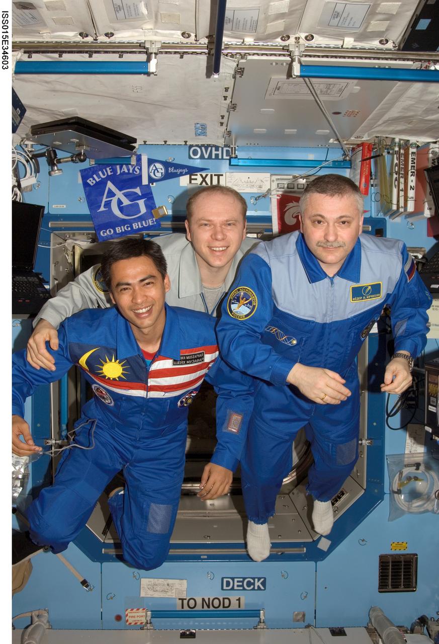 ISS015-E-34603 (16 Oct. 2007) --- Cosmonauts Fyodor N. Yurchikhin (right) and Oleg V. Kotov (center), Expedition 15 commander and flight engineer, respectively, representing Russia's Federal Space Agency; and Malaysian spaceflight participant Sheikh Muszaphar Shukor pose for a photo in the Destiny laboratory of the International Space Station.